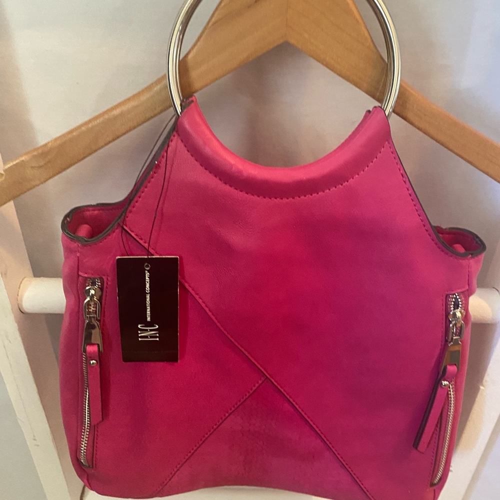 INC NWT a pink handbag.